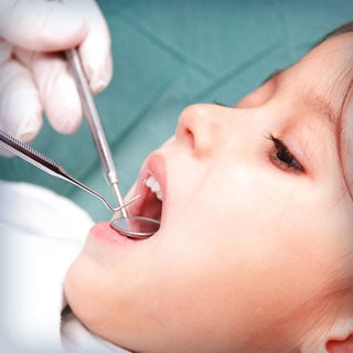 Child receiving dental exam