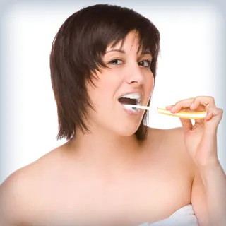 woman brushing teeth