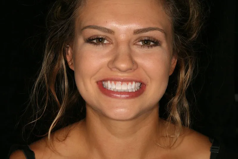 Young woman smiling after image